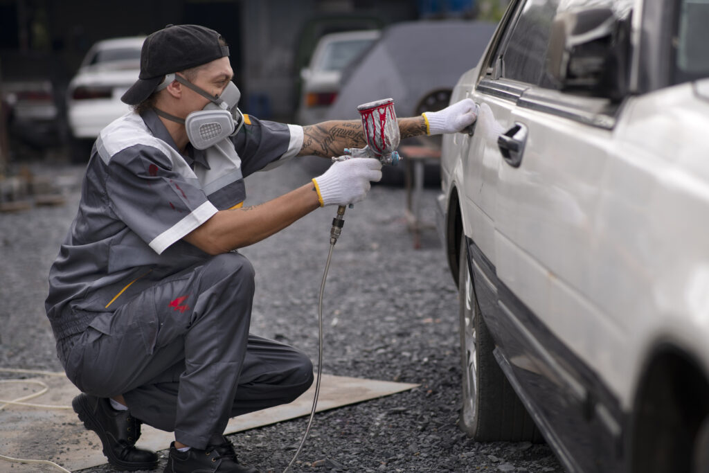 full-shot-man-spraying-powder-paint
